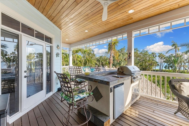 450 Bayshore Dr, Terra Ceia, FL 34250 - wooden deck featuring a grill, outdoor wet bar, ceiling fan, and area for grilling