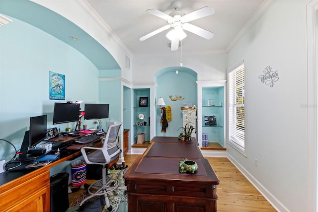 450 Bayshore Dr, Terra Ceia, FL 34250 - home office featuring light wood finished floors, baseboards, ornamental molding, a ceiling fan, and arched walkways