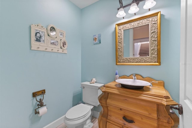 450 Bayshore Dr, Terra Ceia, FL 34250 - bathroom with toilet, vanity, and baseboards