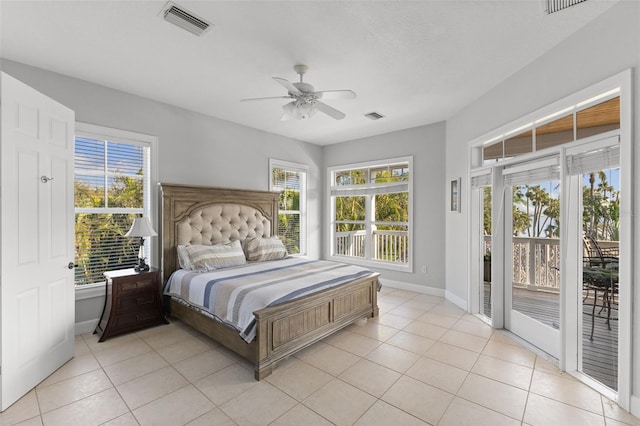 450 Bayshore Dr, Terra Ceia, FL 34250 - bedroom featuring light tile patterned floors, baseboards, access to exterior, and visible vents