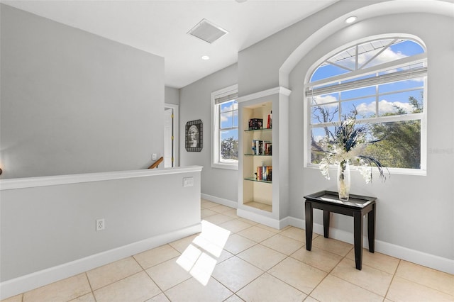 450 Bayshore Dr, Terra Ceia, FL 34250 - foyer featuring a wealth of natural light, baseboards, and light tile patterned floors