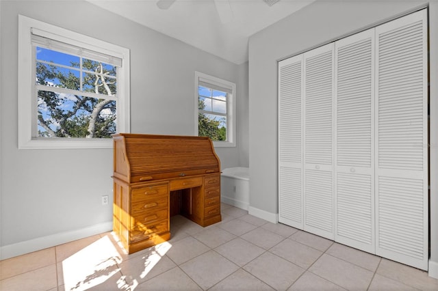 450 Bayshore Dr, Terra Ceia, FL 34250 - unfurnished office featuring a ceiling fan, light tile patterned flooring, and baseboards