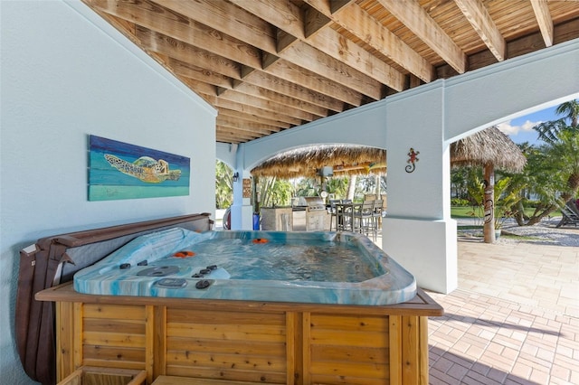 450 Bayshore Dr, Terra Ceia, FL 34250 - view of patio with exterior kitchen and a hot tub