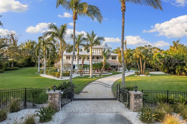 450 Bayshore Dr, Terra Ceia, FL 34250 - view of home's community featuring a gate, a fenced front yard, and a yard