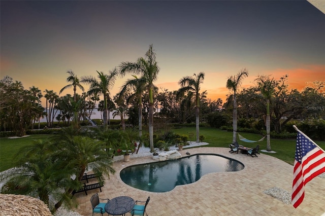 450 Bayshore Dr, Terra Ceia, FL 34250 - outdoor pool featuring a lawn and a patio area