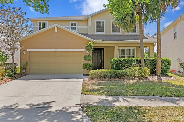 traditional home with concrete driveway, stucco siding, roof with shingles, and an attached garage