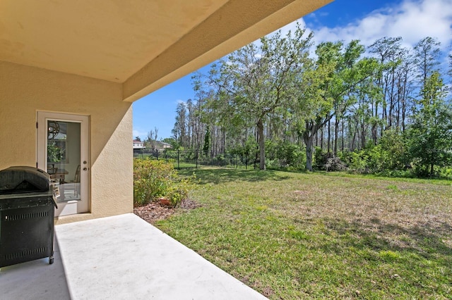 view of yard featuring a patio and fence