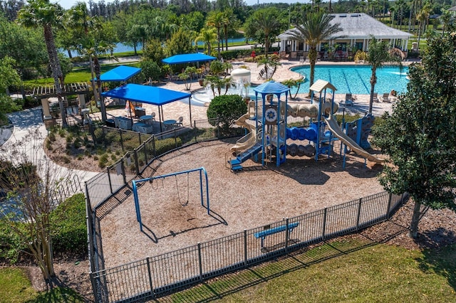 exterior space featuring a community pool and fence