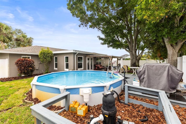 view of pool featuring a fenced in pool and a fenced backyard