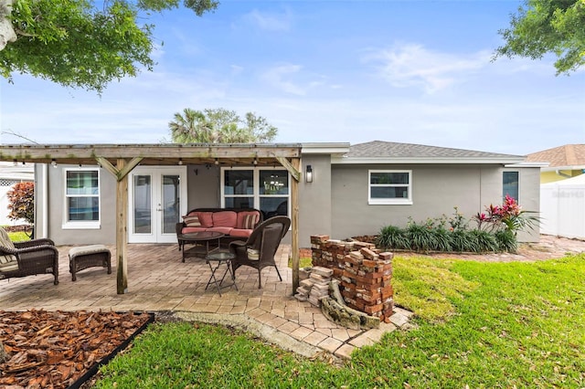 rear view of house featuring a patio, stucco siding, french doors, an outdoor hangout area, and fence