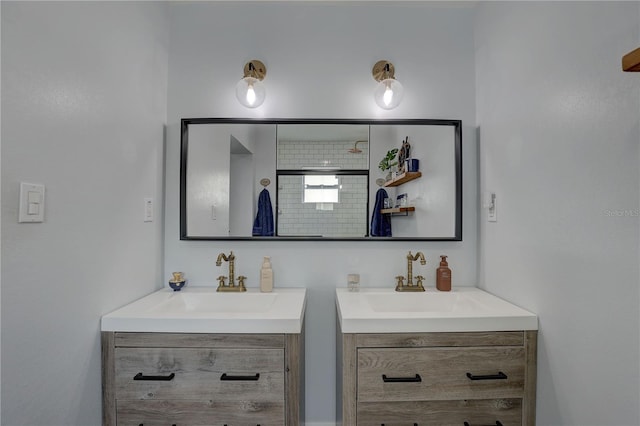 bathroom with a sink and two vanities
