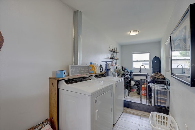 washroom featuring independent washer and dryer and laundry area