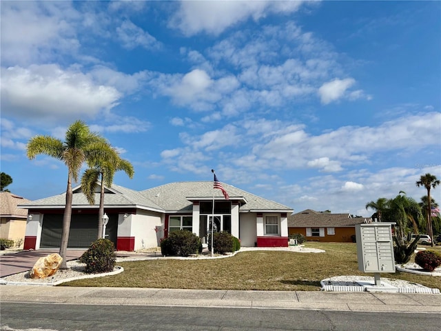 301 Caloosa Palms Ct, Sun City Center, FL 33573 - single story home featuring a garage, concrete driveway, a front lawn, and stucco siding
