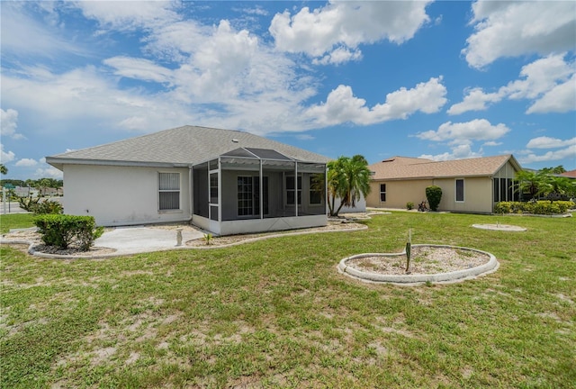 301 Caloosa Palms Ct, Sun City Center, FL 33573 - rear view of house featuring a lawn, a patio, and stucco siding