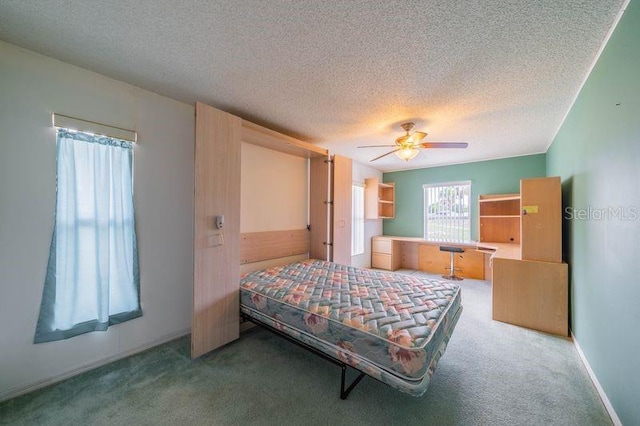 301 Caloosa Palms Ct, Sun City Center, FL 33573 - carpeted bedroom with a textured ceiling and a ceiling fan