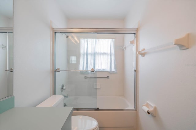 301 Caloosa Palms Ct, Sun City Center, FL 33573 - bathroom featuring vanity and bath / shower combo with glass door