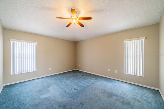 301 Caloosa Palms Ct, Sun City Center, FL 33573 - spare room featuring healthy amount of natural light, ceiling fan, carpet flooring, and a textured ceiling