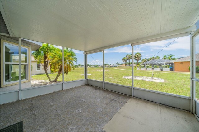 301 Caloosa Palms Ct, Sun City Center, FL 33573 - unfurnished sunroom featuring plenty of natural light and a residential view