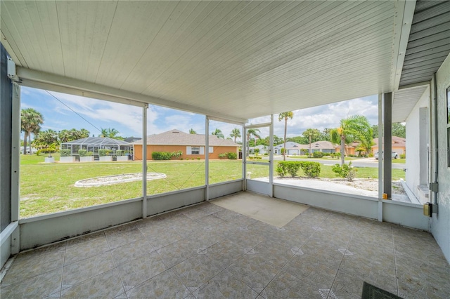 301 Caloosa Palms Ct, Sun City Center, FL 33573 - unfurnished sunroom featuring a residential view