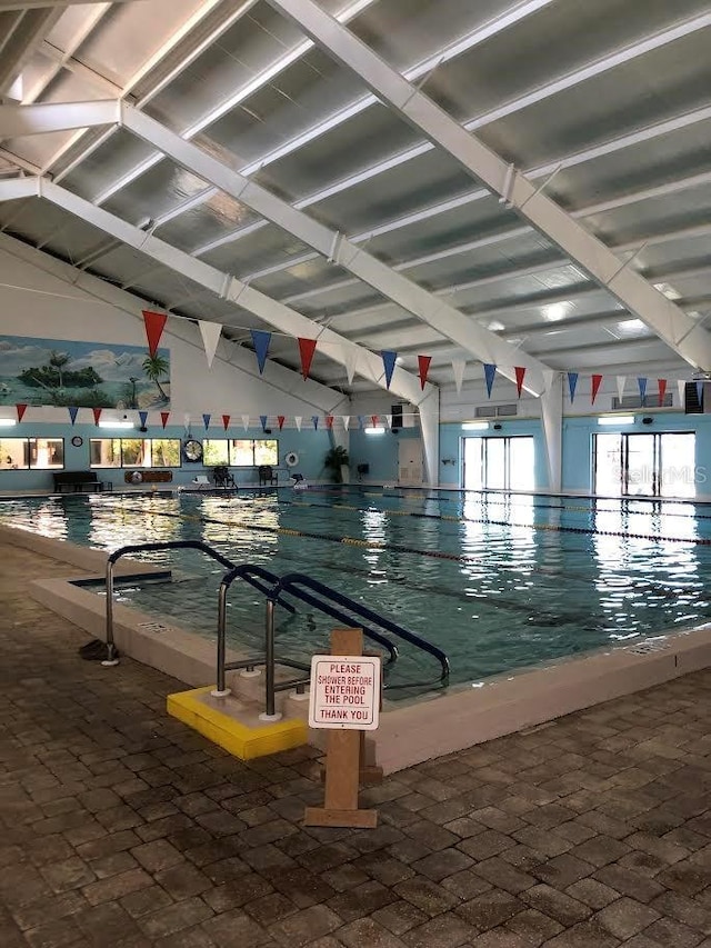 301 Caloosa Palms Ct, Sun City Center, FL 33573 - view of home's community featuring a pool