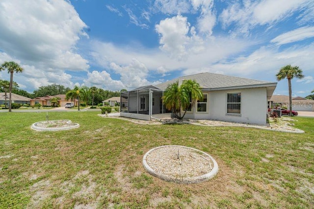 301 Caloosa Palms Ct, Sun City Center, FL 33573 - back of house with stucco siding and a yard