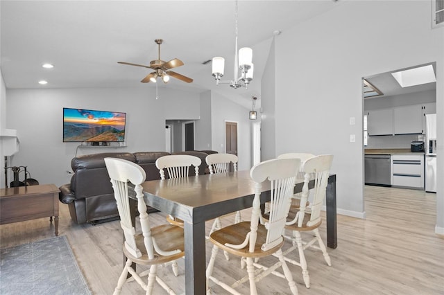 dining room featuring baseboards, a ceiling fan, recessed lighting, light wood finished floors, and vaulted ceiling