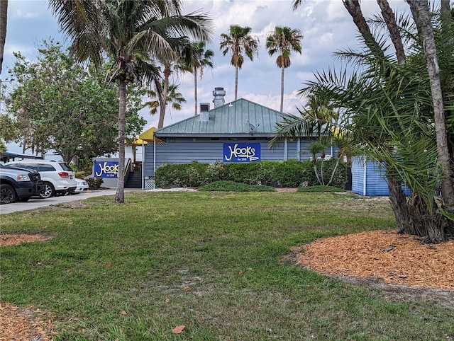 exterior space with a front lawn