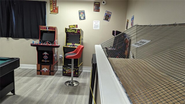 playroom featuring pool table, baseboards, and wood finished floors