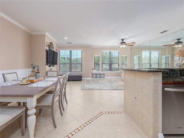 2709 Via Cipriani Unit 522B, Clearwater, FL 33764 - dining space featuring light tile patterned floors, visible vents, a ceiling fan, and ornamental molding