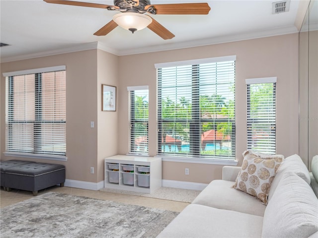 2709 Via Cipriani Unit 522B, Clearwater, FL 33764 - living room featuring baseboards, ornamental molding, visible vents, and plenty of natural light