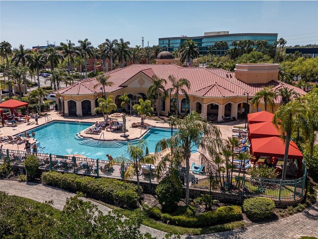 2709 Via Cipriani Unit 522B, Clearwater, FL 33764 - pool featuring a patio area and fence
