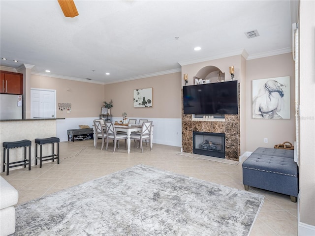 2709 Via Cipriani Unit 522B, Clearwater, FL 33764 - living area featuring ornamental molding, visible vents, recessed lighting, and light tile patterned floors