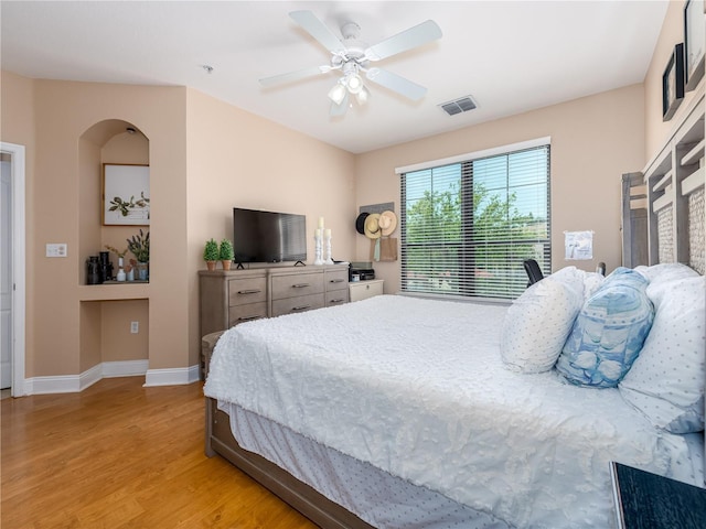 2709 Via Cipriani Unit 522B, Clearwater, FL 33764 - bedroom with visible vents, baseboards, ceiling fan, and light wood-style floors