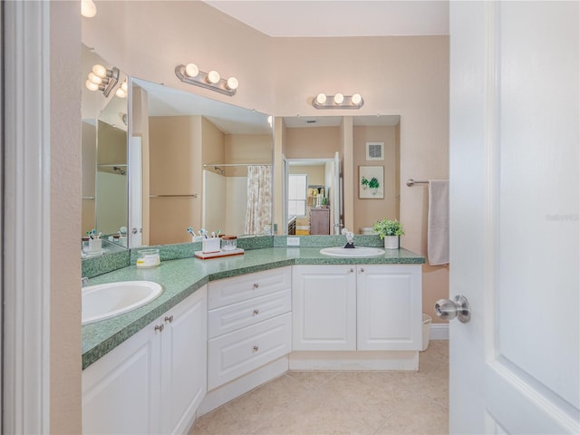 2709 Via Cipriani Unit 522B, Clearwater, FL 33764 - full bathroom featuring double vanity, a sink, tile patterned flooring, and visible vents