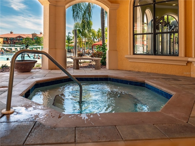 2709 Via Cipriani Unit 522B, Clearwater, FL 33764 - view of swimming pool featuring a patio area and a community hot tub