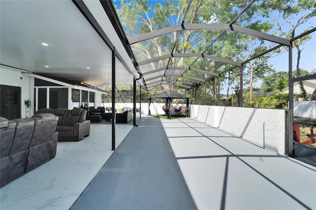 view of patio featuring an outdoor hangout area and a lanai