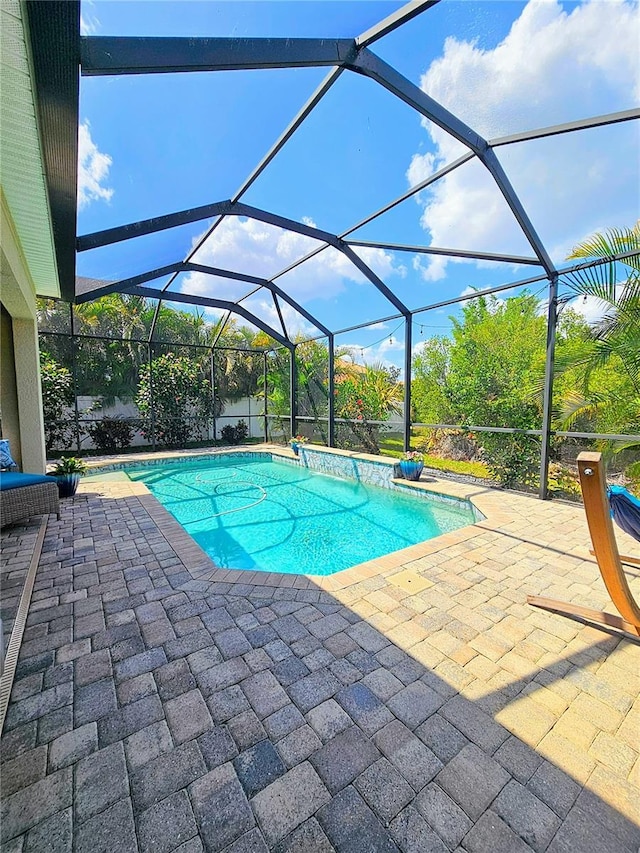 pool with a patio area and a lanai