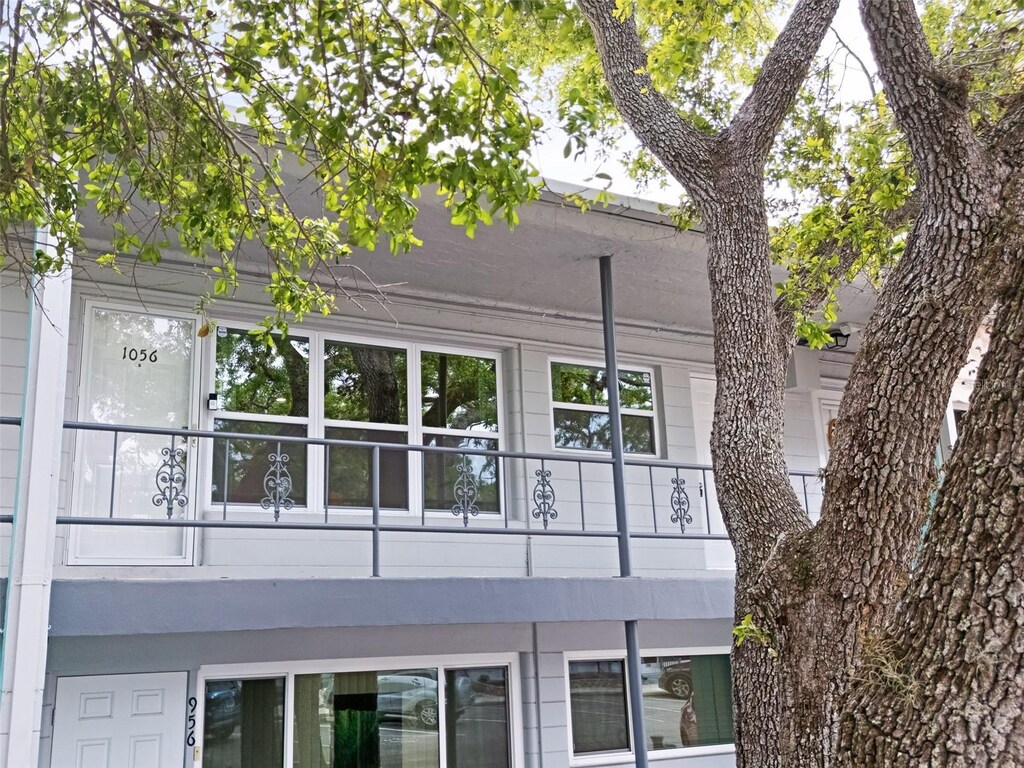 view of side of home with a balcony