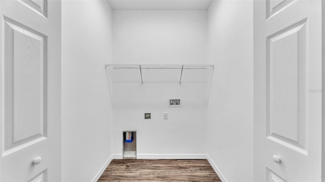 washroom featuring hookup for a washing machine, baseboards, laundry area, dark wood-type flooring, and hookup for an electric dryer