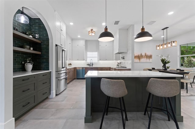 806 W Adalee St, Tampa, FL 33603 - kitchen featuring high end refrigerator, recessed lighting, a sink, tasteful backsplash, and white cabinets