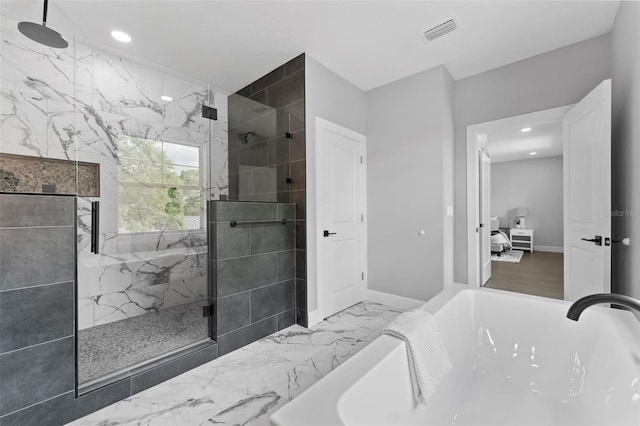 806 W Adalee St, Tampa, FL 33603 - bathroom with a freestanding bath, a marble finish shower, marble look tile flooring, recessed lighting, and connected bathroom