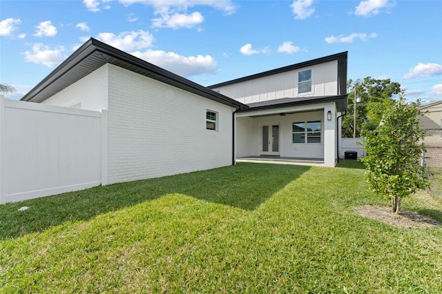 806 W Adalee St, Tampa, FL 33603 - back of property featuring french doors, brick siding, and board and batten siding