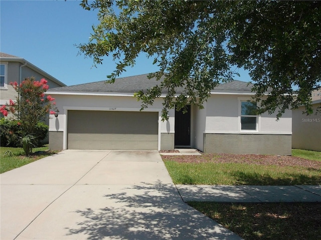 11527 Southern Creek Dr, Gibsonton, FL 33534 - single story home with a garage, stucco siding, and concrete driveway