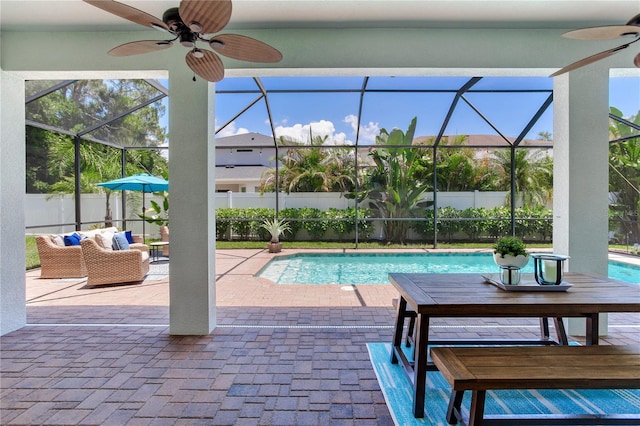 13008 Eagles Entry Dr, Odessa, FL 33556 - view of swimming pool featuring a ceiling fan, a fenced backyard, a patio area, and glass enclosure