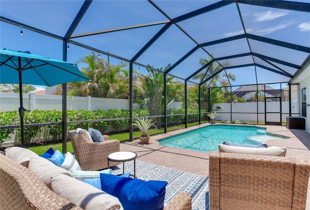 13008 Eagles Entry Dr, Odessa, FL 33556 - view of pool featuring an outdoor living space, a patio, a fenced backyard, and glass enclosure