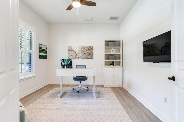 13008 Eagles Entry Dr, Odessa, FL 33556 - office space with wood finished floors, ceiling fan, and baseboards
