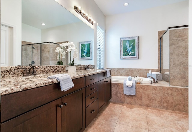 13008 Eagles Entry Dr, Odessa, FL 33556 - full bathroom featuring double vanity, a bath, a stall shower, tile patterned flooring, and recessed lighting