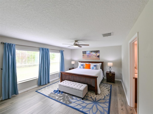6416 Cobble Bliss St, Zephyrhills, FL 33541 - bedroom with a ceiling fan, wood finished floors, baseboards, and visible vents