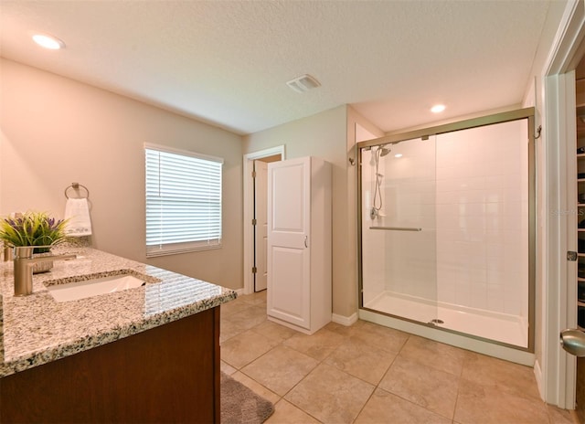 6416 Cobble Bliss St, Zephyrhills, FL 33541 - full bath with visible vents, recessed lighting, vanity, a stall shower, and tile patterned flooring