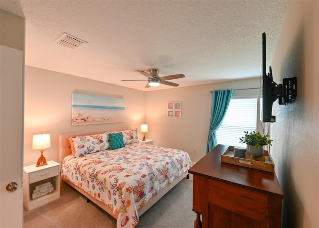 6416 Cobble Bliss St, Zephyrhills, FL 33541 - carpeted bedroom featuring visible vents, a ceiling fan, and a textured ceiling